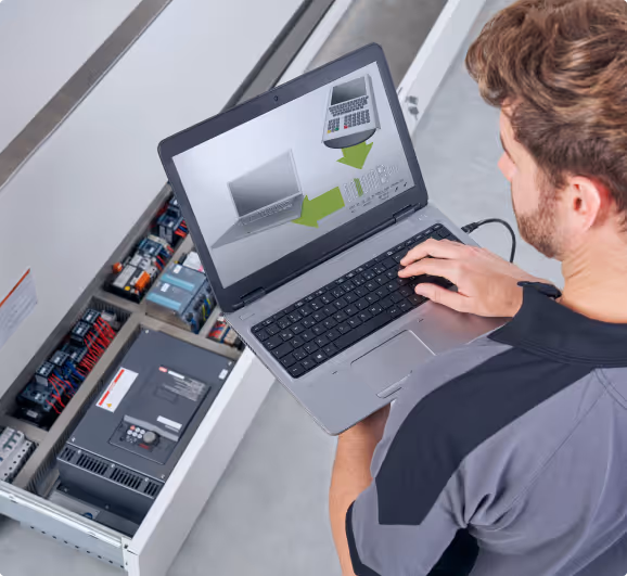 Technical support specialist monitoring system performance on laptop computer